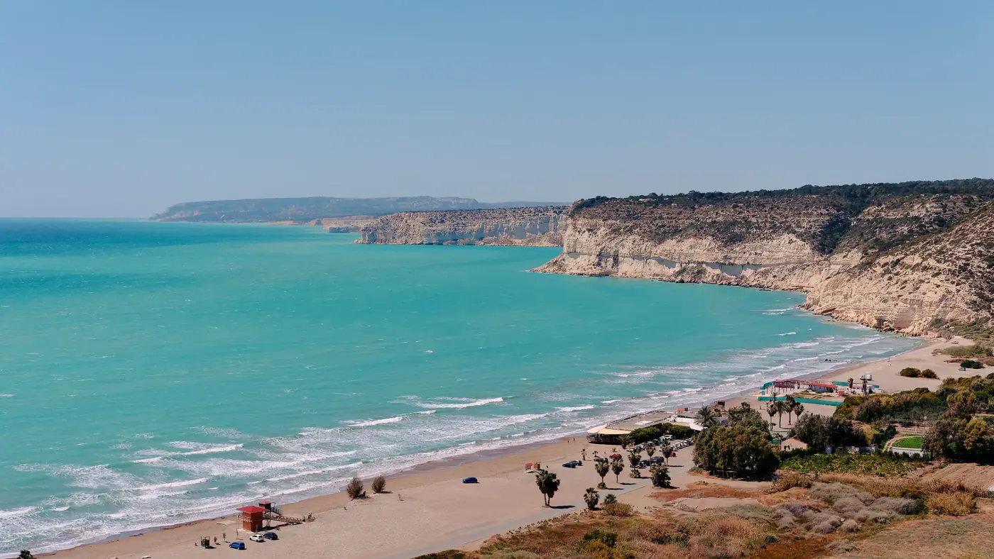 Beautiful beach and cliffside view in Episkopi, Cyprus, highlighting turquoise waters and natural beauty.