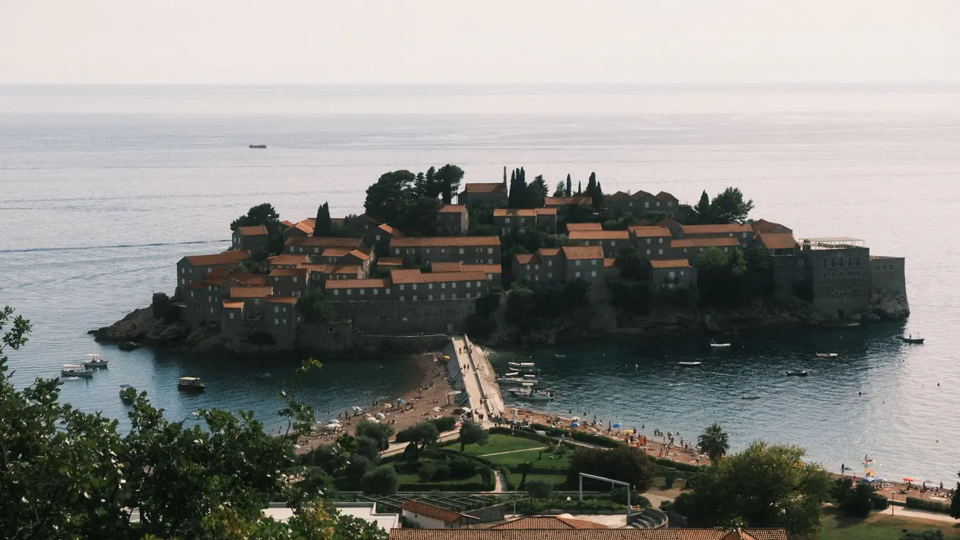 Scenic aerial view of Sveti Stefan, a picturesque island and resort in Montenegro.