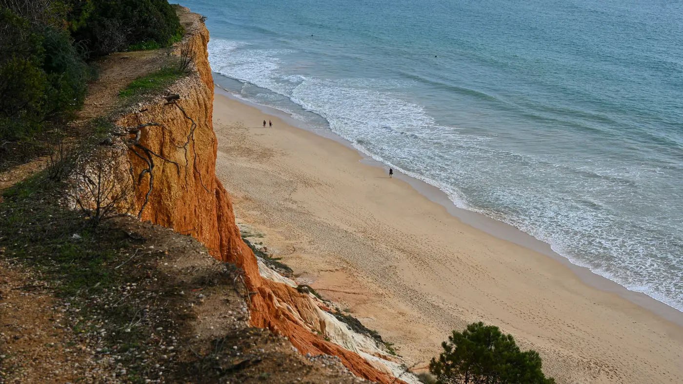 Dramatic cliffs overlooking the beautiful beaches of Faro, Portugal.